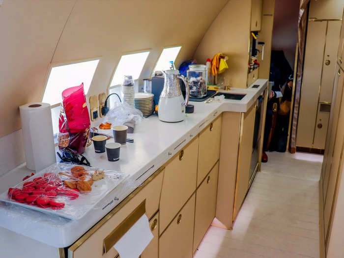 The main galley is hidden from view and is where flight attendants will craft the meals and drinks for the flight, as well as perform other flight duties.