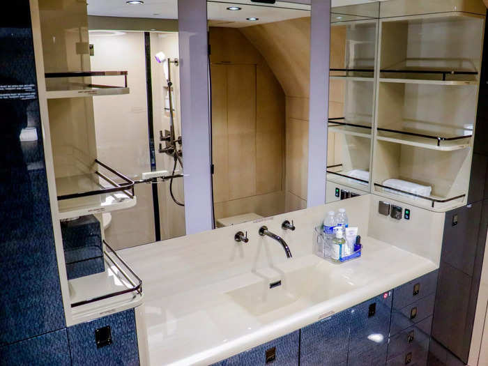 Attached to the bedroom is an ensuite bathroom featuring a full sink and vanity with plenty of space to maneuver, unlike in a typical airplane lavatory.
