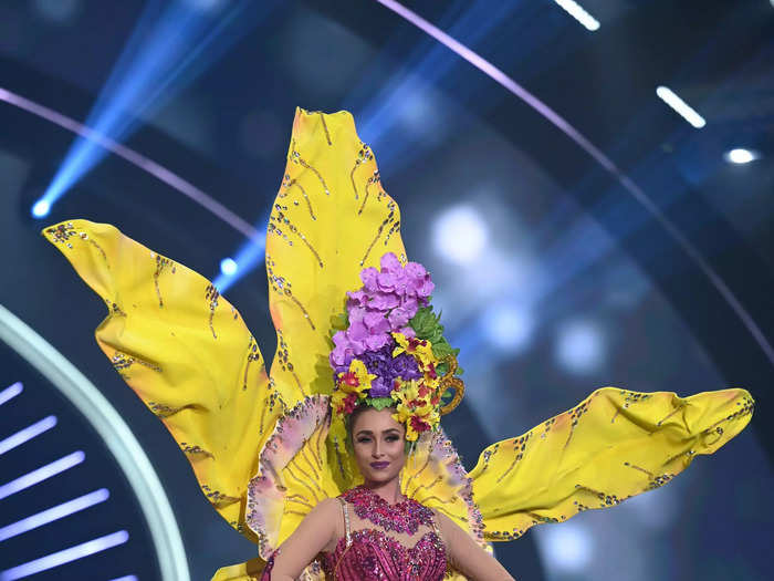 Miss Cayman Islands Georgina Kerford blossomed in a dramatic yellow-and-pink gown that looked fit for a beautiful garden.