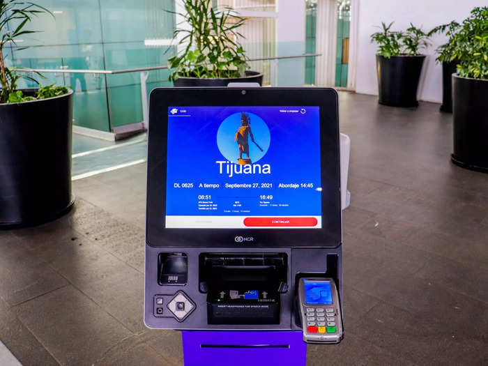 Self-serve kiosks were also available and I stopped by one to see if there were any better seats for the three and a half hour flight.