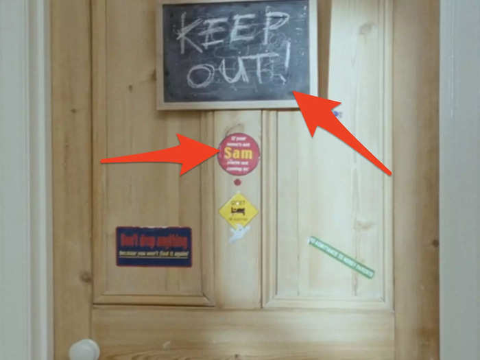 Sam has a variety of stickers on his bedroom door, along with a chalkboard that he uses during the movie.