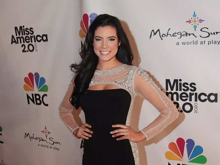 Miss Rhode Island Molly Andrade walked the red carpet at the 2020 Miss America pageant in a black dress with sheer sides and sleeves.