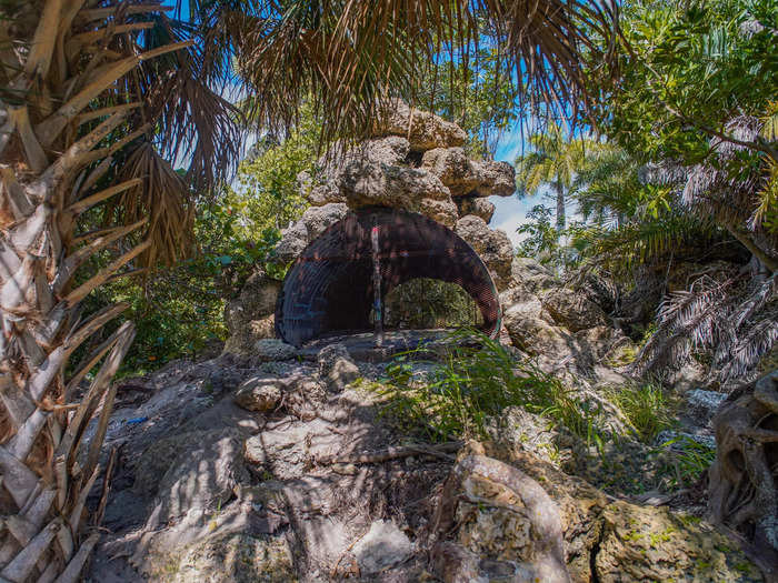 In one shaded area, I spotted what appeared to be an abandoned animal cage embedded in the rocks.