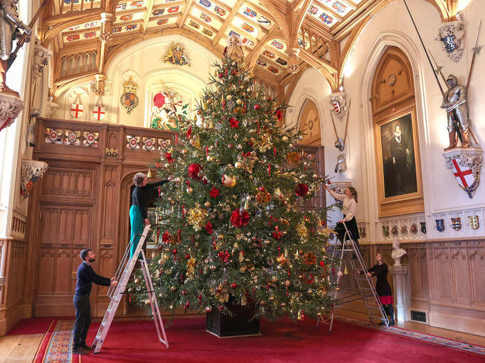 Members of the Royal Collection Trust covered the tree in hundreds of lights as well as glass and mirrored ornaments.