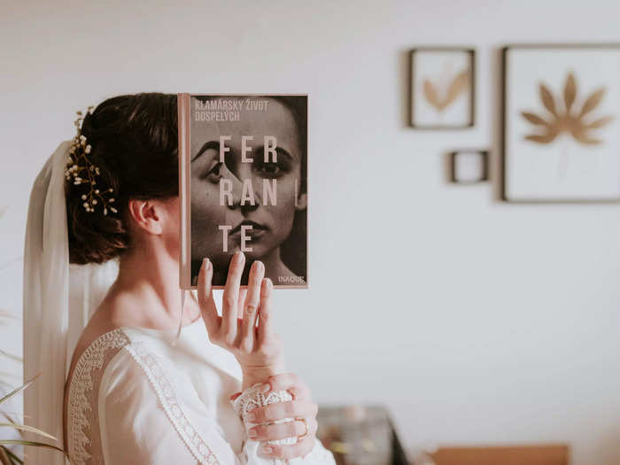 This bride in Slovakia lined her face up perfectly with her book on Elena Ferrante.