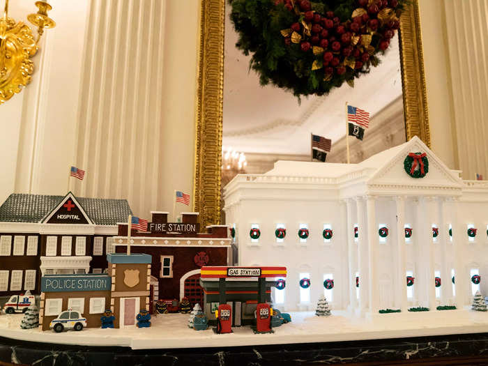 The main attraction in the State Dining Room is the official 2021 Gingerbread White House, created by White House pastry chef Susan Morrison.