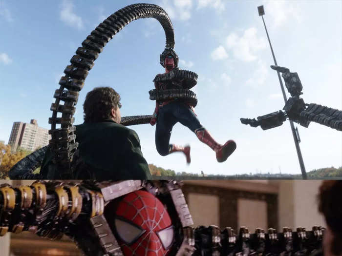 Doc Ock wraps his mechanical arm around Spider-Man