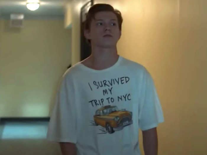 Peter puts on his "I survived my trip to NYC" T-shirt that he wore in "Homecoming."