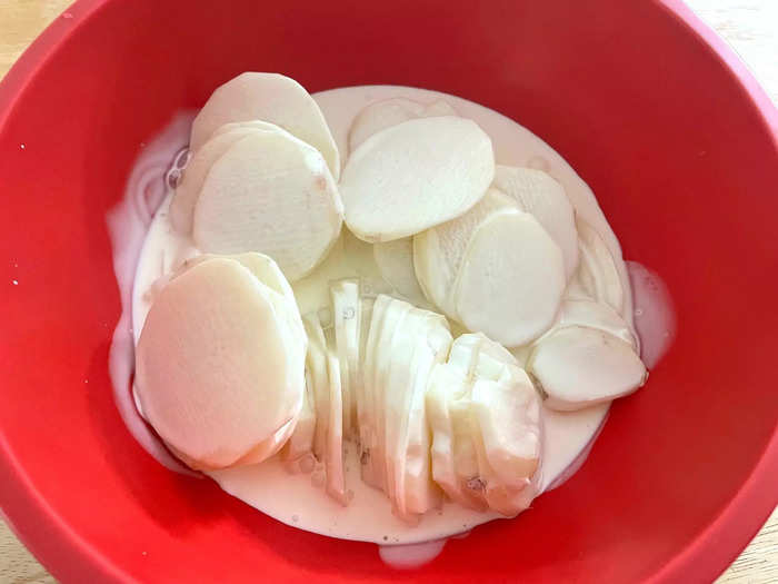 While your stove is working away, add your potatoes to a large bowl with the heavy cream.