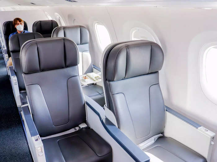 Staggered seats allow for a 2-2 configuration with a greater seat pitch of at least 51 inches. The traditional business class layout on the E170/190 family aircraft is a 1-2 configuration to allow for larger seats.
