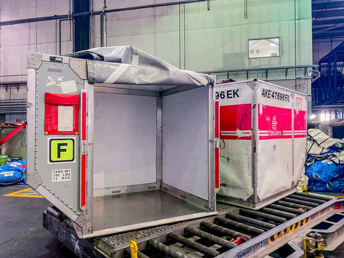 Other boxes will be stored in solid containers and loaded onto the lower deck of an airplane, similar to how passenger baggage is stacked into containers on some long-haul aircraft.