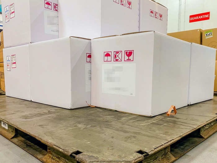 Each box is weight limited at 30 kilograms, around the weight of a checked bag. The facility also has platforms that can be lowered as pallets are stacked so that workers don