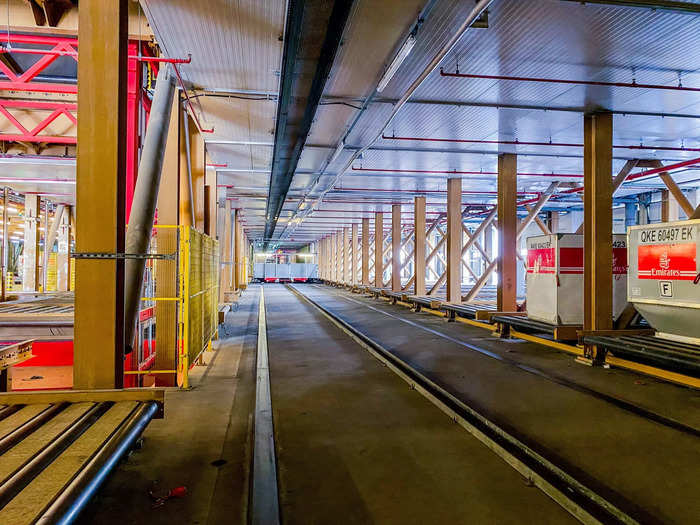 Once pallets and containers arrive at the facility on "dolly trains," or multiple pallets driven by a ground handler, an automated system called the pallet container handling system, or PCHS, takes over and sends them throughout the facility.