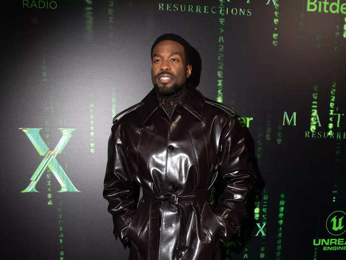 Yahya Abdul-Mateen donned a short black leather trench coat and matching pants.