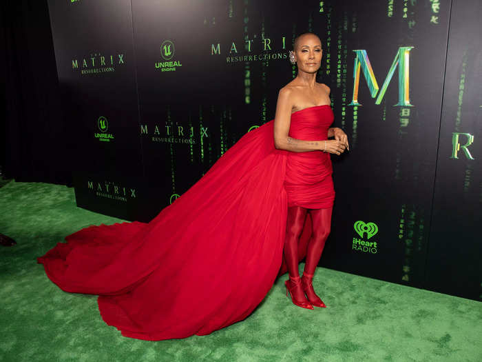 Jada Pinkett Smith wore a ruched red mini dress with a long train.