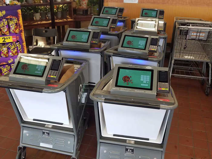 If a shopper comes up to self-checkout with a blue-lighted cart, they can just leave with their items. The carts come stocked with large paper bags, so customers are essentially bagging as they pick up items around the store.