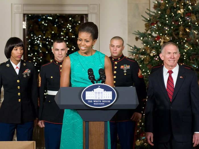 Michelle Obama wore one of her trademark sleeveless dresses in a holiday green in 2009.