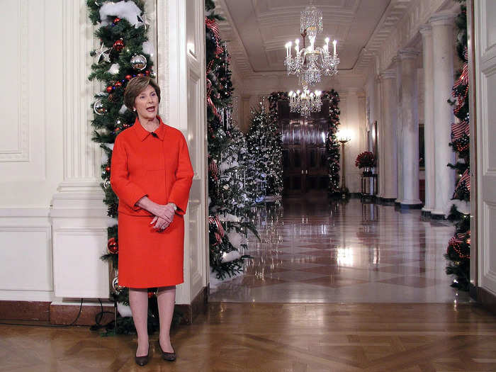 For their final Christmas in the White House, Bush introduced the 2008 decorations in a red skirt suit.