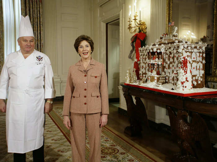 Bush wore a tan suit with red buttons as she showed off the gingerbread White House in the State Dining Room in 2006.