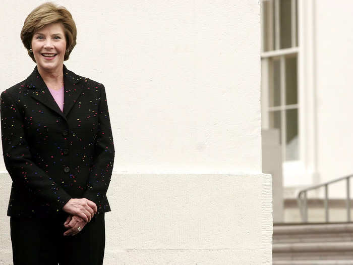 She welcomed the 2005 White House Christmas Tree dressed in a tweed multicolored suit jacket and black skirt.