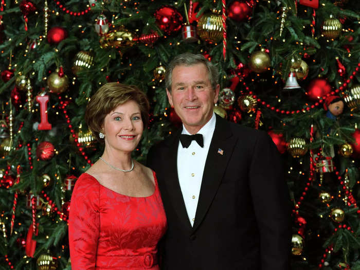 Laura Bush wore a red belted gown designed by Arnold Scaasi for the official 2003 Christmas portrait.