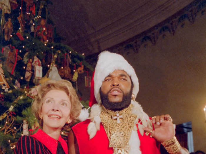 She wore a red striped dress with a red collar when she welcomed Mr. T to the White House.