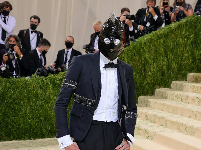 "Gossip Girl" actor Evan Mock wore a leather face mask with spikes to the Met Gala.