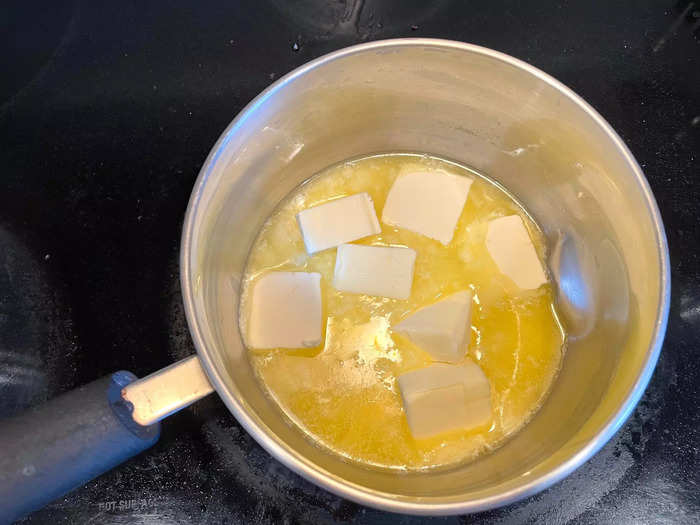 My dad always begins by melting the butter in a saucepan over low heat.