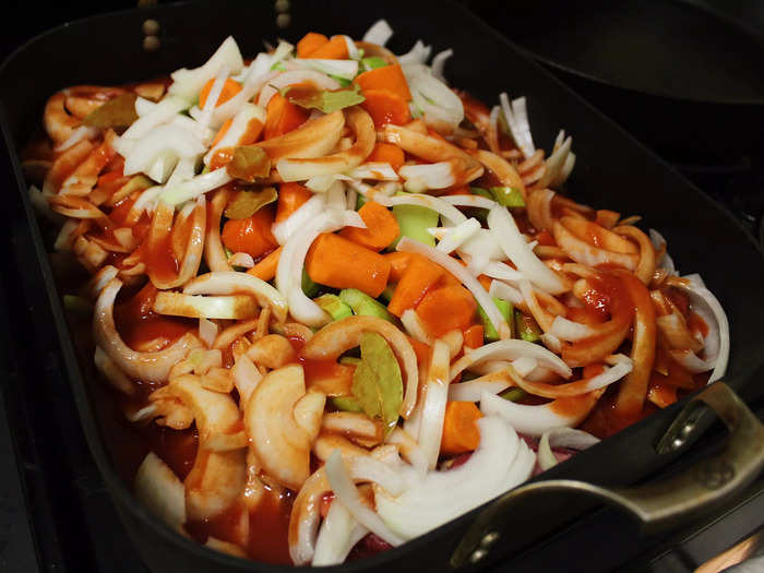 I then added the tomato juice. The recipe suggests pouring it over the pan until the brisket and vegetables are covered three-quarters of the way.