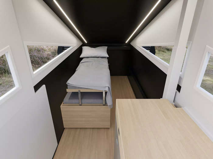 The camper will have outdoor space, an elevated bedroom, a living room, a kitchen, and a bathroom with a toilet and shower …