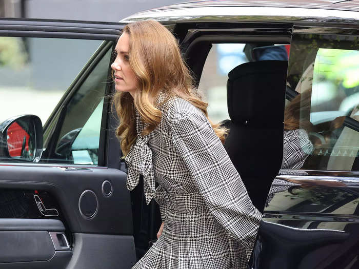 While meeting with researchers at University College London in October, Kate Middleton wore a fall-appropriate plaid dress with matching heels.