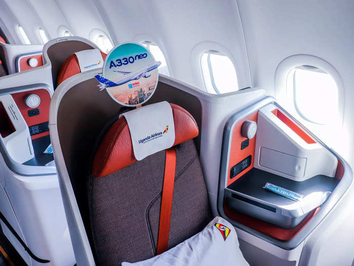 Each seat offers standard business class seat amenities including a seat-back entertainment screen, personal reading lamp, adjustable headrest, and bounds of storage space.