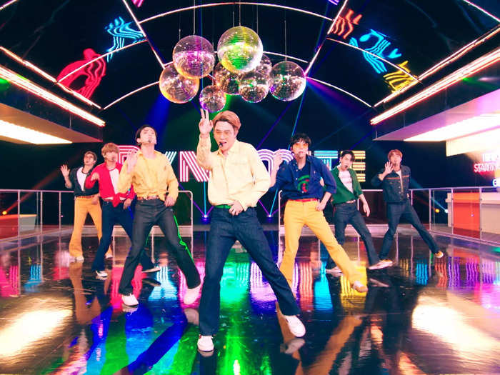 BTS wore retro styles with designer labels for a performance of their single "Dynamite" on "The Tonight Show Starring Jimmy Fallon" in 2020.