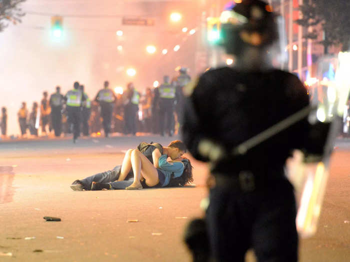 The couple kissing on the streets of Vancouver during a riot