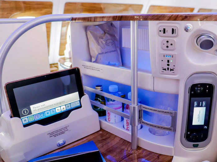 The personal mini bar is a rare amenity for business class and Emirates stocks still and sparkling water, as well as a plastic cup.