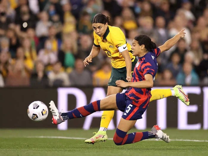 11/30: Australian star Sam Kerr shoots on goal under pressure from USWNT defender Alana Cook.