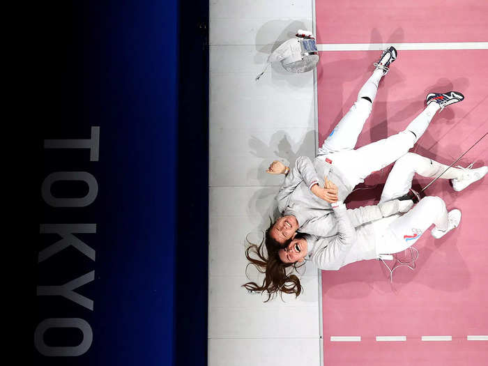 7/31: Olga Nikitina (Bottom) and Sofia Pozdniakova of team ROC celebrate winning the Women