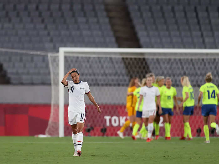 7/21: Christen Press looks dejected after her USWNT concedes a third goal to Sweden during the women