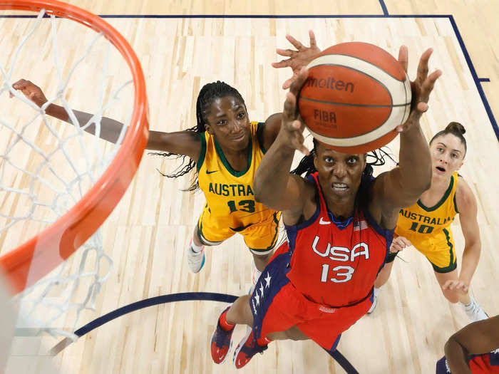 7/16: Sylvia Fowles (center) pulls in a rebound against Australia