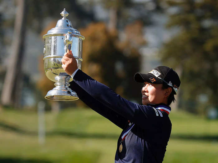 6/6: Yuka Saso of the Philippines celebrates with the Harton S. Semple Trophy after winning the US Women