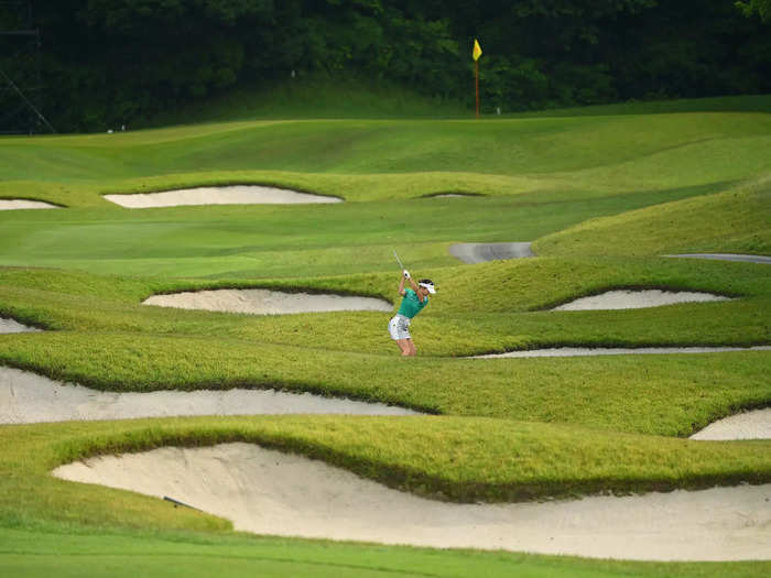 5/28: Karen Tsuruoka of Japan hits her second shot during the first round of the Resorttrust Ladies in Toyota, Aichi, Japan.