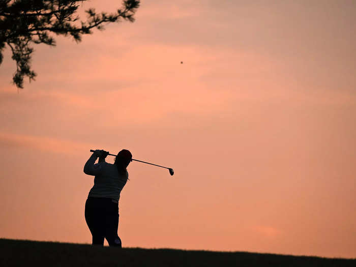 4/9: Japanese golfer Rena Ishikawa hits her second shot during the Fujiflim Studio Alice Ladies Open in Miki, Hyogo, Japan.