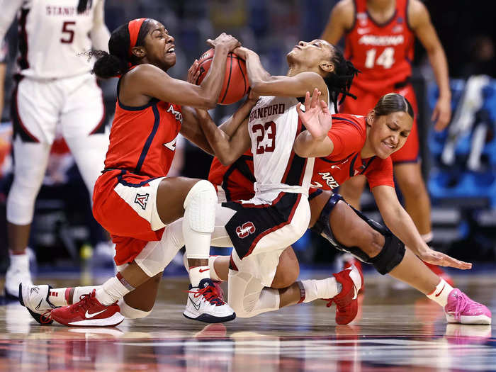 4/4: Arizona Wildcats guard Aari McDonald (left) steals the ball from Stanford Cardinal point guard Kiana Williams during the 2021 national championship game.