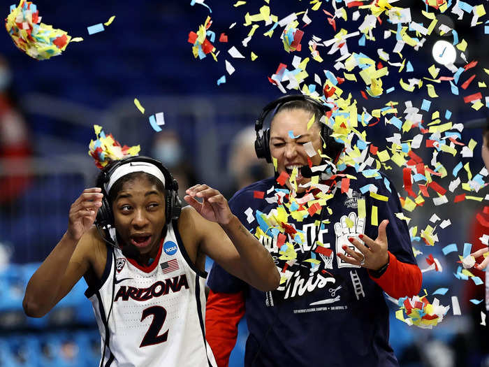 3/29: Aari McDonald and Arizona Wildcats head coach Adia Barnes react to getting covered with confetti after their win over the Indiana Hoosiers during the Elite Eight of the 2021 NCAA Women