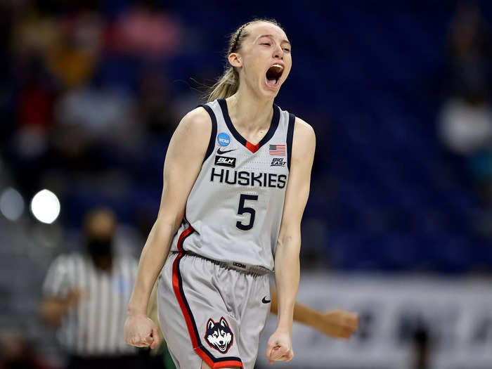 3/29: UConn Huskies star Paige Bueckers celebrates draining a three pointer against the Baylor Bears during the Elite Eight of the 2021 NCAA Women