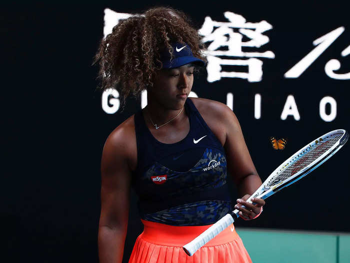 2/12: Naomi Osaka watches as a butterfly flutters over her racket during the third round of the Australian Open.