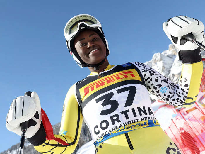 2/11: Kenyan skier Sabrina Simader smiles after completing her run in the Women