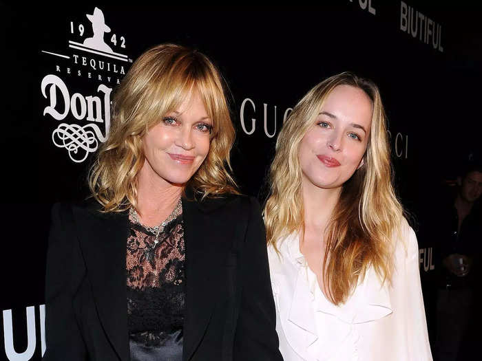 Dakota Johnson and her mom Melanie Griffith wore matching expressions and contrasting outfits on a red carpet later that year.