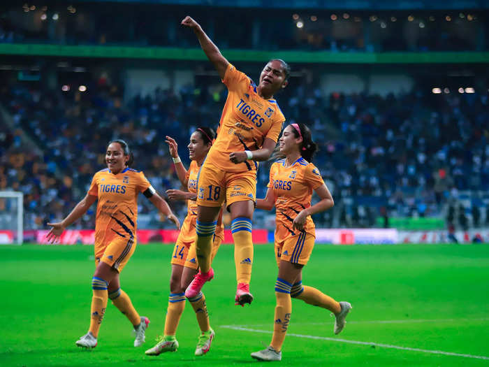 12/17: Greta Espinoza of Tigres celebrates with teammates after scoring the first goal against Monterrey in front of 34,191 fans at BBVA Stadium in Monterrey, Mexico.