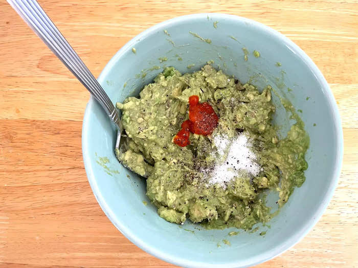 I added my lemon juice and Sriracha to the avocado mixture, along with salt and pepper.